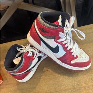 Jordan Kids Red, White, and Black Sneakers lost and found